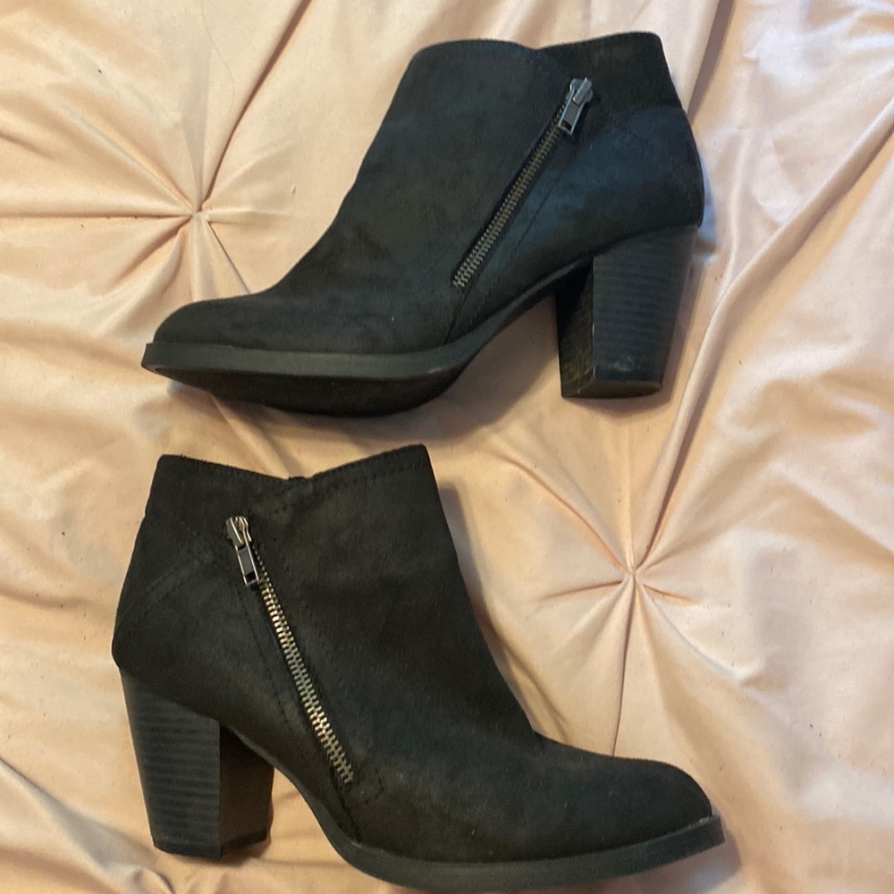 Black booties with zipper detail on the side
